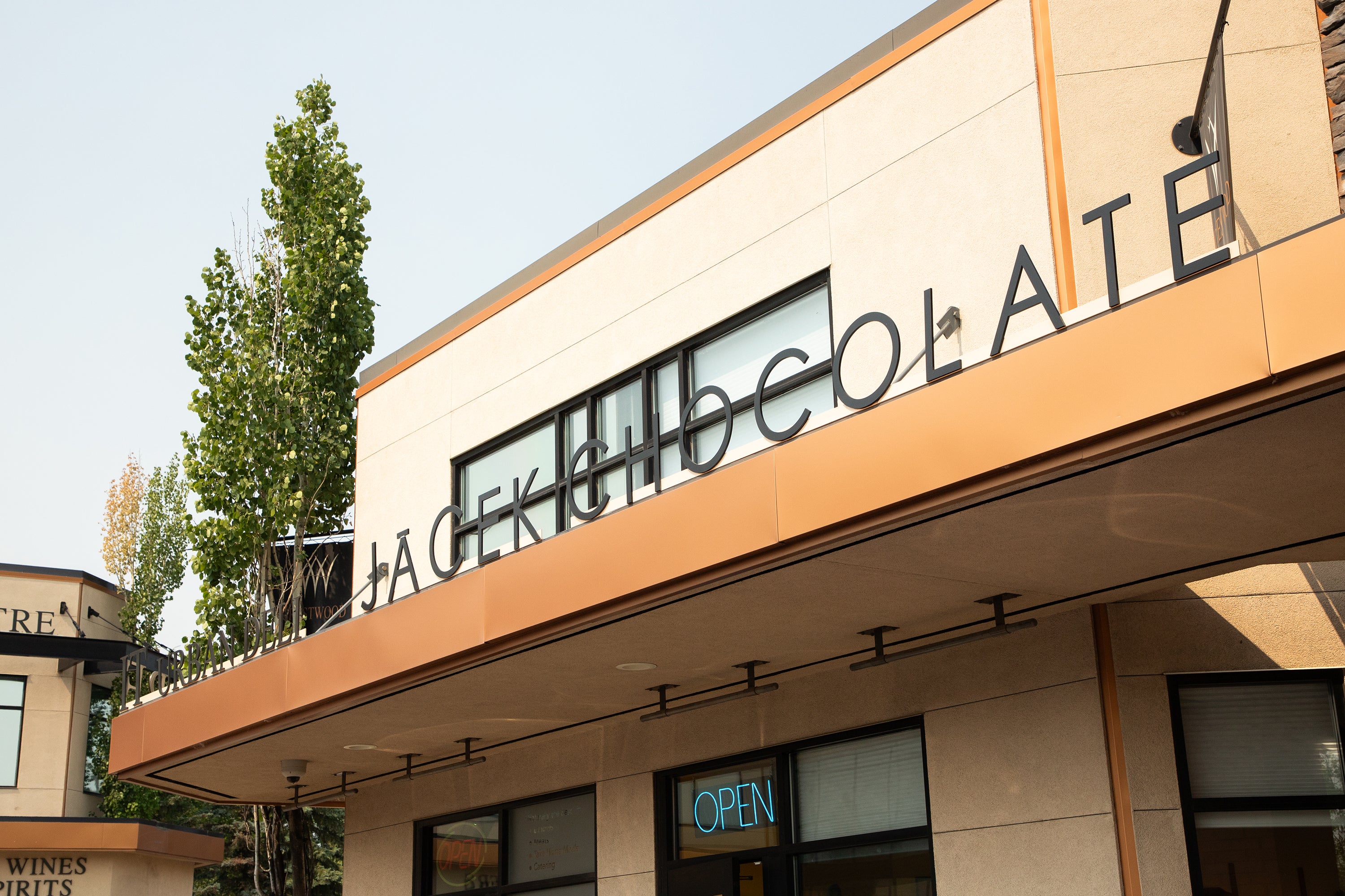 Outside view of JACEK chocolate signage on crestwood store