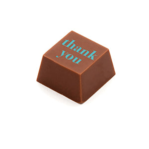 A square shaped milk chocolate, with the message 