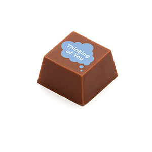 A square shaped chocolate, with the message 