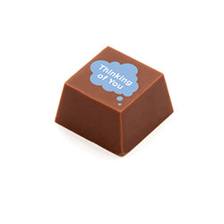 Image of A square shaped chocolate, with the message 